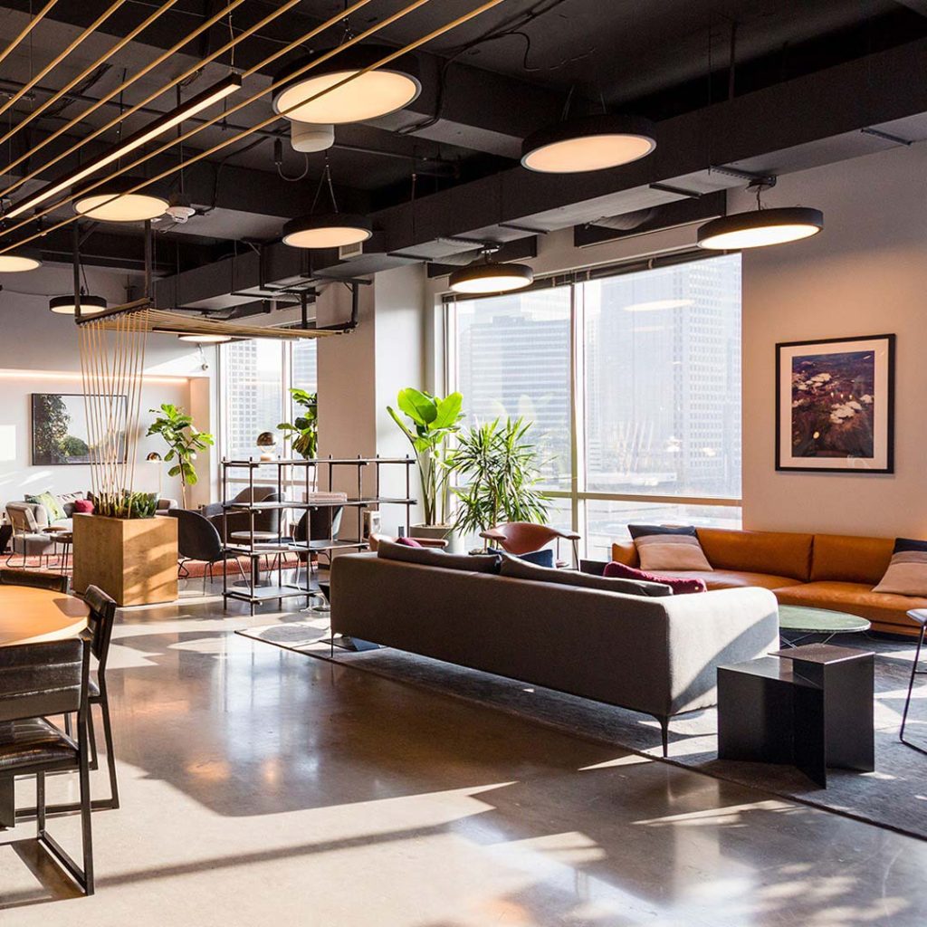 Modern office lounge with leather sofas, pendant lights and city views, BURG+CO. Marketing office